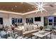 Relaxing community room with seating, tables, and large screen TV at 29571 Velletri Ln, Wesley Chapel, FL 33545