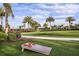Relaxing lawn area with cornhole game at 29571 Velletri Ln, Wesley Chapel, FL 33545