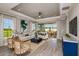 Spacious living room with a view of the backyard and modern furniture at 29571 Velletri Ln, Wesley Chapel, FL 33545