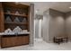 Clean locker room with shower and bench seating at 29571 Velletri Ln, Wesley Chapel, FL 33545