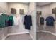 Large walk-in closet with double hanging rods and shelving at 29571 Velletri Ln, Wesley Chapel, FL 33545
