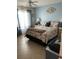 Bright bedroom with a queen-size bed and tiled floors at 3540 42Nd S St # C, St Petersburg, FL 33711