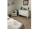 Guest bedroom with comfy chair and dresser at 3540 42Nd S St # C, St Petersburg, FL 33711