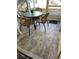 Cozy screened porch with table and chairs at 3540 42Nd S St # C, St Petersburg, FL 33711