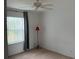 Bright bedroom with window, ceiling fan and carpet at 37729 Neukom Ave, Zephyrhills, FL 33541