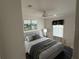 Spacious bedroom with ceiling fan and window at 37729 Neukom Ave, Zephyrhills, FL 33541