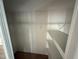 Shelved closet with wire racks for hanging and storage at 37729 Neukom Ave, Zephyrhills, FL 33541