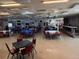 Large community hall with tables and chairs at 37729 Neukom Ave, Zephyrhills, FL 33541