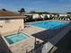 Community pool and spa with lounge chairs at 37729 Neukom Ave, Zephyrhills, FL 33541