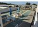 Community shuffleboard court with seating at 37729 Neukom Ave, Zephyrhills, FL 33541