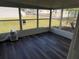 Sunroom with vinyl flooring and large windows at 37729 Neukom Ave, Zephyrhills, FL 33541