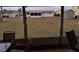 View of backyard from screened porch, showing grassy area at 4031 Cluster Dr, Holiday, FL 34691
