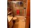 Bathroom with shower/tub combo, toilet and shelving unit at 4031 Cluster Dr, Holiday, FL 34691