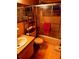Clean bathroom with shower/tub combo, toilet and shelving unit at 4031 Cluster Dr, Holiday, FL 34691