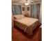 Bedroom with double bed, ceiling fan, and window coverings at 4031 Cluster Dr, Holiday, FL 34691