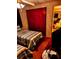 Bedroom with two twin beds, a closet, and a view into another room at 4031 Cluster Dr, Holiday, FL 34691