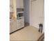 Efficient kitchen with white cabinets and built-in appliances at 4031 Cluster Dr, Holiday, FL 34691