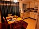 Kitchen and dining area with table and chairs at 4031 Cluster Dr, Holiday, FL 34691
