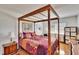 Charming bedroom with a four-poster bed, and dresser at 4188 104Th N Ave, Clearwater, FL 33762