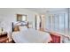 Cozy bedroom featuring a double bed, hardwood floors, and built-in closet at 4188 104Th N Ave, Clearwater, FL 33762