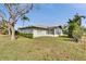Single story home with screened patio and yard at 4188 104Th N Ave, Clearwater, FL 33762