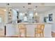 Kitchen with breakfast bar, granite countertops, and stainless steel appliances at 4188 104Th N Ave, Clearwater, FL 33762