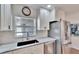 Modern kitchen with white cabinets, granite countertops, and stainless steel appliances at 4188 104Th N Ave, Clearwater, FL 33762