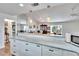 White kitchen features granite countertops and stainless steel appliances at 4188 104Th N Ave, Clearwater, FL 33762