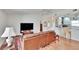 Open concept living area with a comfortable leather couch and modern TV at 4188 104Th N Ave, Clearwater, FL 33762
