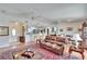 Open concept living room with a view of kitchen, dining area, and sliding door to patio at 4188 104Th N Ave, Clearwater, FL 33762