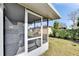 Screened porch with view of backyard and neighboring homes at 4188 104Th N Ave, Clearwater, FL 33762