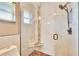 Walk-in shower with glass enclosure and built-in seat at 4188 104Th N Ave, Clearwater, FL 33762