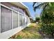 Exterior view of sunroom and surrounding landscape at 4188 104Th N Ave, Clearwater, FL 33762