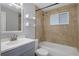 Updated bathroom, featuring a tile shower/tub combo at 4925 Beacon Hill Dr, New Port Richey, FL 34652