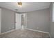 Bedroom with tile floors and access to another room at 4925 Beacon Hill Dr, New Port Richey, FL 34652