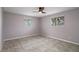 Bright bedroom with tile floors and window with blinds at 4925 Beacon Hill Dr, New Port Richey, FL 34652