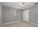 Bedroom with tile floors, a window and closet at 4925 Beacon Hill Dr, New Port Richey, FL 34652