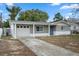 Newly renovated gray house with white accents and a two-car garage at 4925 Beacon Hill Dr, New Port Richey, FL 34652