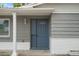 Newly painted front door with a half-circle window at 4925 Beacon Hill Dr, New Port Richey, FL 34652