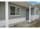 Newly painted front door and trim with white columns at 4925 Beacon Hill Dr, New Port Richey, FL 34652