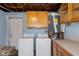 Garage area with cabinets, washer and dryer hookups at 4925 Beacon Hill Dr, New Port Richey, FL 34652