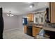 Well-equipped kitchen with wood cabinets and black appliances at 4925 Beacon Hill Dr, New Port Richey, FL 34652