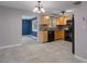 Bright kitchen with wood cabinets, black appliances, and tile flooring at 4925 Beacon Hill Dr, New Port Richey, FL 34652