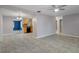 Open concept living room with a view into the kitchen at 4925 Beacon Hill Dr, New Port Richey, FL 34652