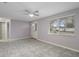 Open living room with tiled floors and neutral walls at 4925 Beacon Hill Dr, New Port Richey, FL 34652
