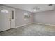 Bright living room with tiled floors and large windows at 4925 Beacon Hill Dr, New Port Richey, FL 34652