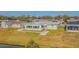 Aerial view showing house and canal at 5040 Victoria Ln, Holiday, FL 34690
