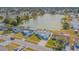 Aerial view of the house and lake at 5040 Victoria Ln, Holiday, FL 34690