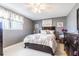 Bedroom with a double bed and dark brown dresser at 5040 Victoria Ln, Holiday, FL 34690