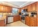 Well-equipped kitchen with stainless steel appliances at 5040 Victoria Ln, Holiday, FL 34690